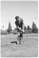 Golfer Fay Coleman demonstrates a series of 
