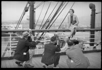 Photographers taking pictures of a woman on the S.S. Mariposa, Los Angeles