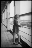 Little girl looking out to the harbor on the S.S. Mariposa, Los Angeles