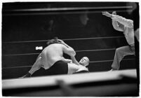 Wrestlers "Daniel Boone" Savage and Hans Steinke battle it out at the Grand Olympic Stadium.  June 16, 1937.