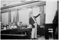 Public defender Ellery Cuff indicating a point on a map at his client Albert Dyer's murder trial, Los Angeles, 1937