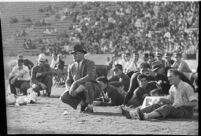 Loyola Lions with their coaches on the Coliseum field, Los Angeles, 1937