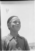 Boy takes part in a free summer camp organized by Los Angeles Sheriff Eugene Biscailuz.  Circa July 1937.