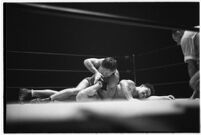 Heavyweight wrestler Vincent López grappling with newcomer El Pulpo at the Olympic, Los Angeles, 1937