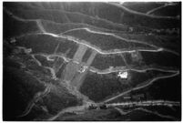 Aerial view of flood devastation in hilly area of North Hollywood, Los Angeles, 1938