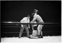 Heavyweight wrestler El Pulpo grappling with an opponent at the Olympic Auditorium, Los Angeles, 1937