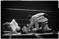 Heavyweight wrestler El Pulpo grappling with an opponent at the Olympic Auditorium, Los Angeles, 1937