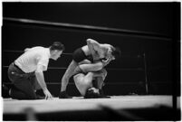 Heavyweight wrestler El Pulpo grappling with an opponent at the Olympic Auditorium, Los Angeles, 1937