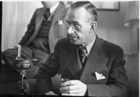 German author Thomas Mann seated in a chair, Los Angeles