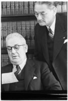 Attorneys Otto Christensen and Alfred MacDonald during an investigation of the feud between former law partners Col. William H. Neblett and Senator William Gibbs McAdoo, Los Angeles, 1938