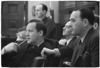 Unidentified courtroom scene with 6 men observing