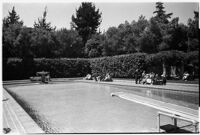 Swimming pool and diving board on the estate of film comedian Harold Lloyd and his wife Mildred, Beverly Hills, 1927