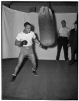 Boxer Henry Armstrong trains with a punching bag, Los Angeles, 1930s