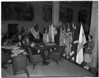 Military officials gather for a celebration of the American flag during a military show for National Defense Week, Los Angeles, 1940