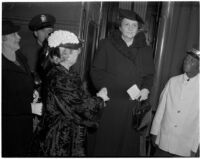 Antoinette Jones welcomes Secretary of Labor Frances Perkins upon her arrival by train, Los Angeles, 1940