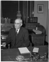 Republican politician Arthur M. Hyde sitting at a desk, Los Angeles, 1940
