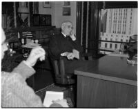 Republican politician Arthur M. Hyde sitting at a desk, Los Angeles, 1940