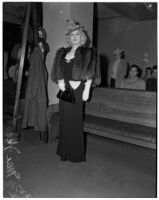 Mae West in court during questioning about earnings from her role in the movie "She Done Him Wrong," Los Angeles, 1940