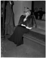 Mae West sitting in court during questioning about earnings from her role in the movie "She Done Him Wrong," Los Angeles, 1940