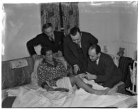 Dr. W.L. Carver with boxer Ceferino Garcia, his manager George Parnassus, and Everett Saunders from the State Athletic Commission, Los Angeles, 1940