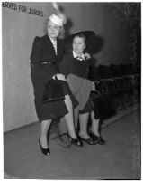 Gladys Jackson sits with LaVerne Andre in a courthouse, Los Angeles, 1930s