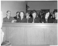 Samuel Karnes, Sr., Johanna Karnes, Edith Karnes, and Audrey Burns sit in the courtroom during the preliminary trial for Betty Flay Hardaker, Los Angeles, 1940