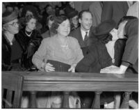 Cowboy film extra Jerome "Blackjack" Ward kisses his wife Mickey Ward during his trial for the murder of fellow extra Johnny Tyke, Los Angeles, July 1940