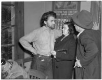 Cowboy film extra Jerome "Blackjack" Ward with his wife Mickey during a re-enactment of his confrontation with fellow extra Johnny Tyke, Los Angeles, February 24, 1940