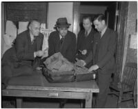 Detective Lieutenants R.S. Hamilton, E.J. Henry, and E.C. Biffle with suspect Adolfo Campos and a suitcase full of smuggled marijuana, Los Angeles