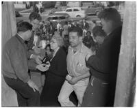 Members of the Worker's Alliance at 1st and Soto Streets protesting a 40% cut to checks given out to S.R.A. relief workers, Los Angeles, February 27, 1940