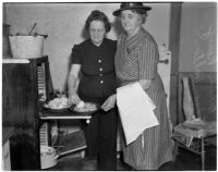 Mrs. Hiram Raney and Mrs. Edna Horton baking biscuits, Los Angeles