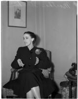 Portrait of dancer and choreographer Martha Graham sitting in a chair, Los Angeles, circa 1940