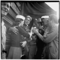 Group celebrates Japan's surrender during World War II on Main Street in downtown Los Angeles, August 15 and 16, 1945