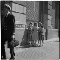 Woman talking to a group of truant girls in downtown Los Angeles, March 1946