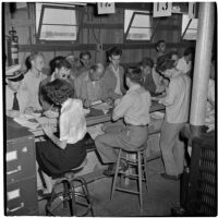 Veterans filling out paperwork to purchase Quonset huts and other surplus military supplies, Port Hueneme, July 15, 1946