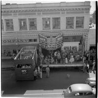 View of street shops during the post-war Labor Day parade, Los Angeles, 1946