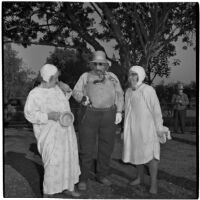 Three costumed characters at a picnic celebration for Labor Day, Los Angeles, 1946