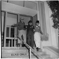 Elks Club manager Len P. Bonnat and two others during Anaheim's annual Halloween festival, Anaheim, October 31, 1946