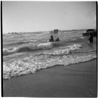 Military personnel practice a water rescue during the Army-Navy maneuvers that took place off the coast of Southern California in late 1946