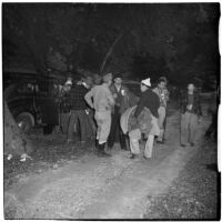 Boy Scout Troop 47 drinking hot chocolate after being marooned overnight in the Arroyo Seco Canyon, Los Angeles, December 9, 1946