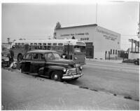 Automobile and bus that competed in a planned race to demonstrate the importance of following traffic laws, Los Angeles, 1947