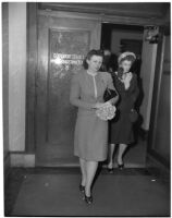 Betty Alice Phillips walks out of Superior Court with her mother, Alice Campbell, after declaring she wanted to relinquish custody of her two children, Los Angeles, 1947