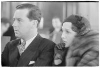 Actor Ben Lyon with his wife, actress Bebe Daniels, during a trial for Albert F. Holland, who wrote 150 love letters to Daniels, Los Angeles, 1933