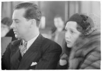 Actor Ben Lyon with his wife, actress Bebe Daniels, during a trial for Albert F. Holland, who wrote 150 love letters to Daniels, Los Angeles, 1933
