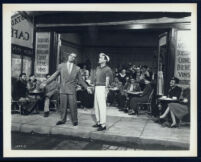 Georges Guetary, Gene Kelly, and other cast members in An American in Paris