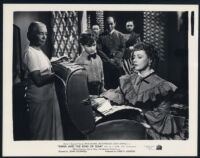 Richard Lyon, Irene Dunne, and other cast members in Anna and the King of Siam