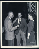 John Farrow, Wally Westmore, and Anne Baxter on the set of Blaze of Noon