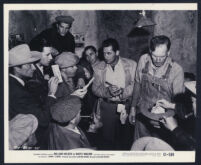 William Holden, Basil Ruysdael, and other cast members in Boots Malone