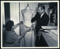 Costume designer Howard Shoup and a dressmaker on the set of Calamity Jane