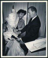 Costume designer Howard Shoup and a dressmaker on the set of Calamity Jane